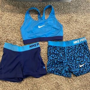 Matching Nike Sports Bra & 2 pairs of spandex shorts set. Shades of blue & navy